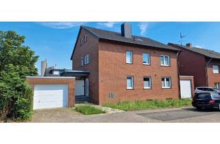 Haus kaufen in 59269 Beckum, Beckum - Zweifamilienhaus mit Garten, Balkon & Garagen im Beckumer Norden