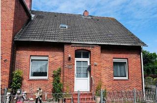 Doppelhaushälfte kaufen in 26736 Krummhörn, Sanierungsbedürftige Doppelhaushälfte mit Garage und Dachterrasse