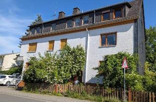 Mehrfamilienhaus kaufen in 65232 Taunusstein, Taunusstein - Mehrfamilienhaus und Baugrund für Käufer mit Vision