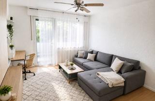 Wohnung kaufen in 64584 Biebesheim, Modernisierte 2-Zimmer-Eigentumswohnung mit zwei Balkonen und Weitblick