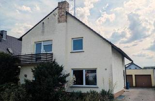 Haus kaufen in 64584 Biebesheim, Biebesheim am Rhein - Zwei- Familienhaus mit Doppelgarage und großem Grundstück.