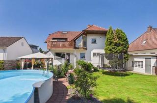 Haus kaufen in 61197 Florstadt, Wohnen ohne Kompromisse – besonderes Zweifamilienhaus in Florstadt mit privater Gartenoase