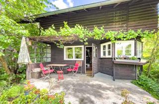 Haus kaufen in 82152 Krailling, Krailling im Würmtal - Charmantes Isartaler Holzhaus auf sonnigem Südwest-Grundstück mit Potenzial