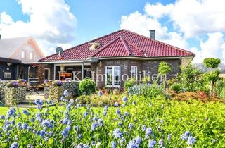 Haus kaufen in 26683 Saterland, Wohnen auf höchstem Niveau – Repräsentativer Bungalow mit Einliegerwohnung direkt an der Sagter Ems