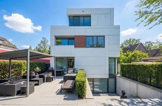Wohnung kaufen in 22589 Sülldorf, Stilvolle Architektenwohnung mit grünem Refugium und überdachter Sonnenterrasse