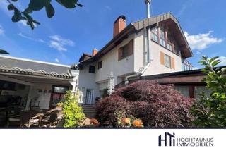 Haus kaufen in 61250 Usingen, HTI | Außergewöhnliches Zweifamilienhaus mit idyllischem Garten inkl. Feldbergblick