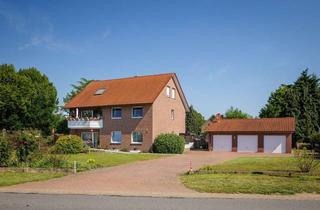 Mehrfamilienhaus kaufen in 32369 Rahden, Voll vermietet, gepflegt und werthaltig – 3-Familienhaus mit Garagen als attraktive Kapitalanlage
