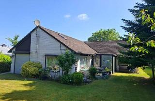 Haus kaufen in 25712 Burg, Charmanter Winkelbungalow mit Wintergarten