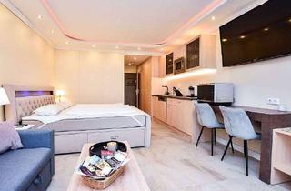 Wohnung kaufen in 23669 Timmendorfer Strand, Eingebettet in die Natur! Formvollendetes Apartment mit seitlichem Ostseeblick