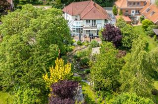 Haus kaufen in 29549 Bad Bevensen, Ein Zuhause zum Verlieben – Exklusives Wohnen am Wasser mit Wintergarten und Garten