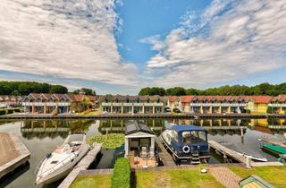 Haus kaufen in 16831 Rheinsberg, Ferienhaus am Wasser: mit privatem Bootsanleger und zusätzlichem Hausboot