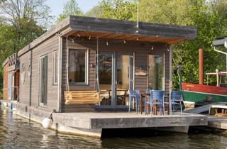 Wohnung kaufen in 24837 Schleswig, Neubau-Hausboot Heuckenlock 65 an der Schlei – Liegeplatz am Wikingturm Schleswig