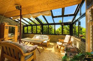 Haus kaufen in 34225 Baunatal, Großzügiges Wohnhaus mit Wintergarten und parkähnlichem Garten in Baunatal-Altenritte