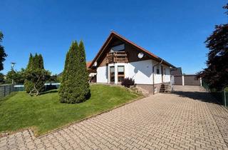 Einfamilienhaus kaufen in 04860 Torgau, Viel Platz im Grünen: Einfamilienhaus mit überdachter Terrasse, Balkon und Doppelgarage nahe Torgau