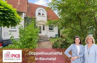 Doppelhaushälfte kaufen in 34225 Baunatal, Wohlfühlhaus: Gepflegte Doppelhaushälfte mit zusätzlichem Wohnraum im Spitzboden