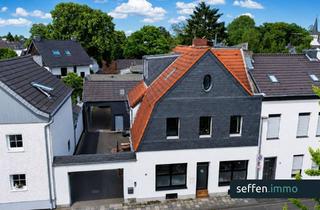 Mehrfamilienhaus kaufen in 50859 Lövenich, Attraktives Mehrfamilienhaus mit Garagen und Innenhof in gefragter Wohnlage im Kölner Westen