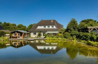 Einfamilienhaus kaufen in 24790 Rade, Großzügiges Einfamilienhaus mit Schwimmteich, Sauna und besonderem Wohnambiente