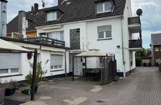 Mehrfamilienhaus kaufen in 46537 Dinslaken, Gepflegtes und gut vermietetes Mehrfamilienhaus mit Garagen und Carports in Dinslaken-Bruch!