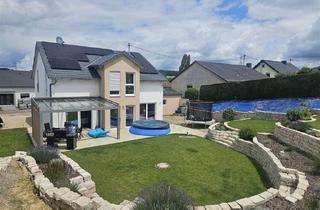 Einfamilienhaus kaufen in 54310 Ralingen, Energieeffizientes Familienanwesen mit Weitblick, großem Grundstück und Nähe zu Luxemburg