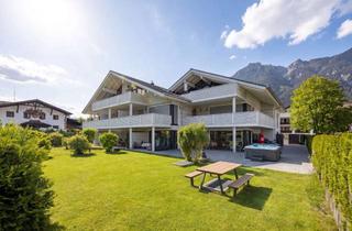 Haus kaufen in 82467 Garmisch-Partenkirchen, Luxuriöse, großzügige 7-Zimmer-Gartenwohnung mit Spa-Möglichkeit im Souterrain