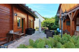 Einfamilienhaus kaufen in 91338 Igensdorf, Igensdorf - Individuelles Holz-Blockhaus mit Wohlfühlambiente