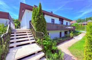 Haus kaufen in Katharinenberg 12, 91350 Gremsdorf, Familienbungalow mit Einliegerwohnung und Doppelgarage auf schönem Hanggrundstück
