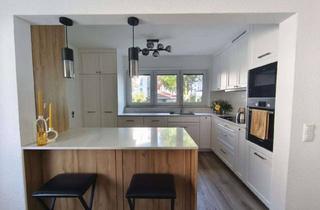 Wohnung kaufen in 71272 Renningen, 4-Zimmer Erdgeschosswohnung mit Garten in Renningen