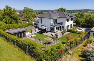 Haus kaufen in 35112 Fronhausen, Geradlinig und Gemütlich: Wellnessgarten in Ruhelage mit Sauna und Whirlpool - Einzugsbereit!