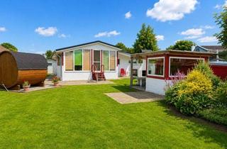 Haus kaufen in 26624 Südbrookmerland, Möbliertes Ferienhaus mit Boot und Fass-Sauna am Wasser!