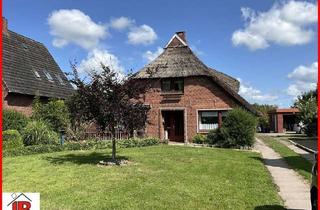 Haus kaufen in 26935 Stadland, Reetdachwohnhaus auf großem Grundstück in Sürwürden