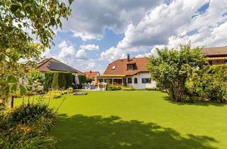 Haus kaufen in 90559 Burgthann, Hegerich: Stilvolles Zweifamilienhaus mit Wintergarten und vielseitigen Nutzungsmöglichkeiten