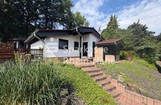 Haus kaufen in 55442 Stromberg, Ihr Rückzugsort in Stromberg-Schindeldorf BungaIow mit idyllischem Garten