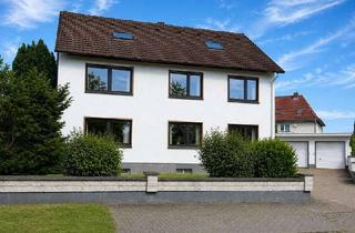 Haus kaufen in 32584 Löhne, Dreifamilienhaus mit drei vermieteten Wohneinheiten und Doppelgarage in Löhne