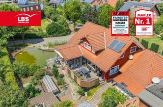 Haus kaufen in 32479 Hille, Vollholz Wohnblockhaus mit Wintergarten, Koi-Teich und Carport – zeitlose Eleganz in naturnaher Lage