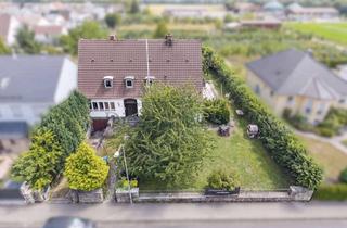 Einfamilienhaus kaufen in 35452 Heuchelheim, Einfamilienhaus mit 258 m² Wohnfläche und großem Garten in Heuchelheim