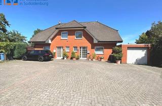Doppelhaushälfte kaufen in 49681 Garrel, Zentrumsnah in Garrel: Gepflegtes Doppelhaus mit Garage und PKW-Stellplätzen!