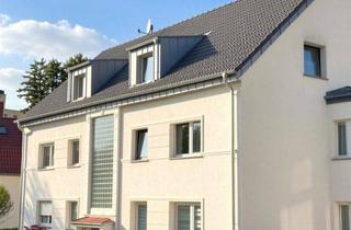 Wohnung kaufen in 42657 Solingen, Modernisierte 3-Zimmer-Wohnung mit neuem Südwestbalkon in grüner Lage