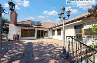 Einfamilienhaus kaufen in 90613 Großhabersdorf, Großzügiger Bungalow, vollunterkellert mit parkähnlichem Grundstück und Doppelgarage.