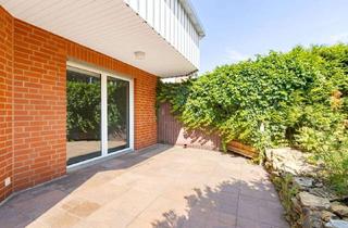 Wohnung kaufen in 49134 Wallenhorst, Exklusive 4-Zimmer-Erdgeschosswohnung mit Garten in ruhiger Lage von Hollage