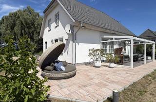 Einfamilienhaus kaufen in 17449 Trassenheide, Schwedenhaus mit sonnigen Garten und Glasveranda