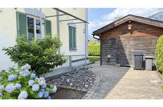 Wohnung kaufen in 83246 Unterwössen, Stilvolle 4-Zimmer-Altbauwohnung mit Gartenanteil in einem liebevoll sanierten 3-Familienhaus