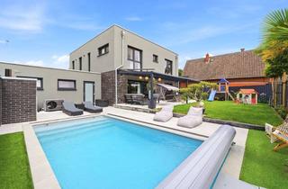 Einfamilienhaus kaufen in 46487 Wesel, Modernes Einfamilienhaus mit Pool, großzügiger Garage, Carport und hochwertigem Wohnambiente