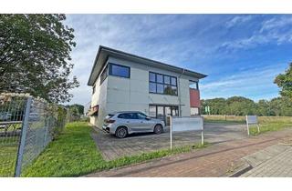 Gewerbeimmobilie kaufen in 46562 Voerde, Repräsentative Gewerbeimmobilie in Voerde-Holthausen mit großer Verkaufsfläche, Büros & Stellplätzen