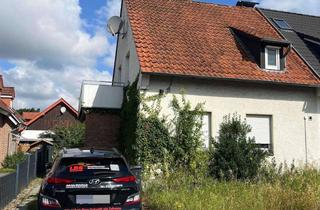 Doppelhaushälfte kaufen in 33790 Halle, Sanierungsbedürftige Doppelhaushälfte in Halle (Westf.)