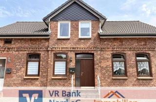 Haus kaufen in 25821 Bredstedt, Attraktive Kapitalanlage: Modernisiertes Wohnhaus mit zwei Wohneinheiten und zwei Garagen