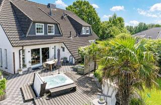Doppelhaushälfte kaufen in 24991 Freienwill, Wohnen unter Palmen in Freienwill: DHH mit Kamin, Gartenidylle und Familienkomfort