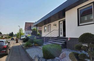 Haus kaufen in 34225 Baunatal, Großzügiger Bungalow mit Wintergarten, Sauna und Solaranlage