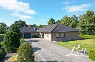 Haus kaufen in 26689 Apen, +++ Großzügiger Bungalow mit ebenerdigem Raumprogramm in beliebter Kanallage von Augustfehn! +++
