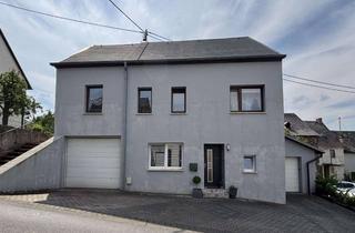 Einfamilienhaus kaufen in 54472 Brauneberg, Gepflegtes Einfamilienhaus mit Terrasse und zwei Garagen