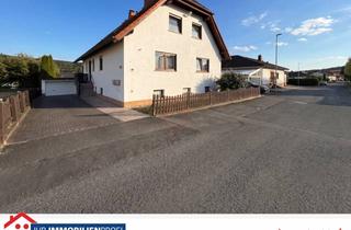 Haus kaufen in 35102 Lohra, Kapitalanlage trifft Eigennutz: Attraktives Dreifamilienhaus in traumhafter Feldrandlage von Lohra